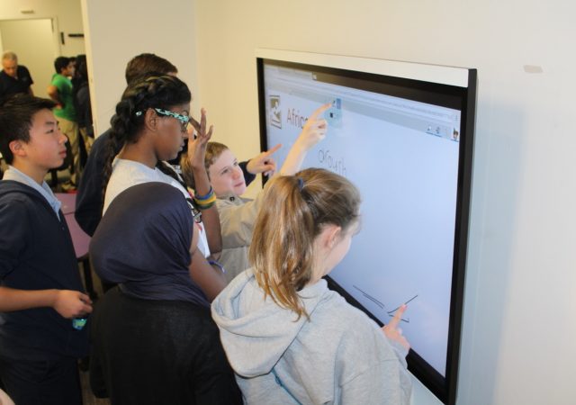students working at smartboard