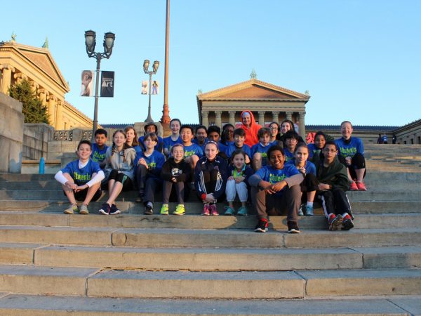 student running group at art museum
