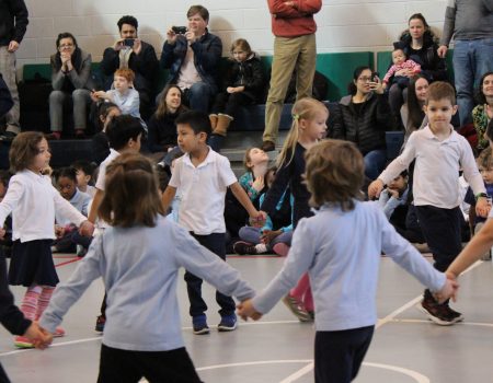 Kindergarten students performing square dance
