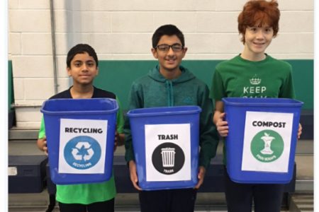 students with recycling bins
