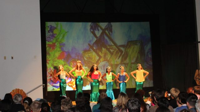 students performing in school musical production