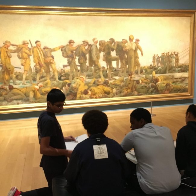 students looking at painting