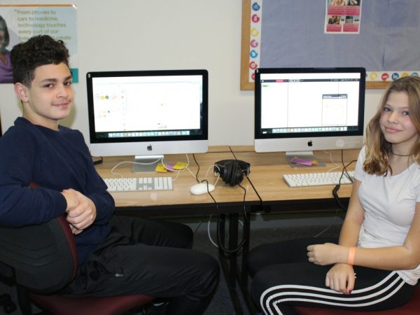 Students working on computer coding activities