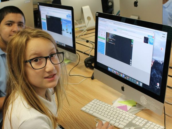 Students working on computer coding activities
