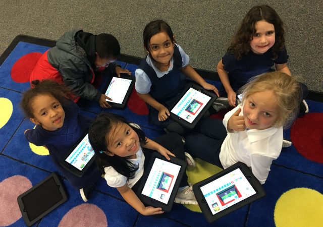 Kindergarten students using iPads